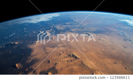 Earth Reveals Vast Desert Landscape from Space with Majestic Mountains and Atmospheric Perspective. Earth Reveals Vast Desert Landscape from Space with Majestic Mountains and Atmospheric Perspective. 123986611