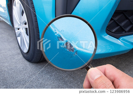 Close up of a scratch on a car bumper 123986956