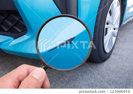 Close up of a scratch on a car bumper 123986958