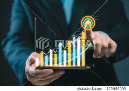 Business man point plan growth increase of positive indicators graph in his business. Planning of business, Graph growth success concept. Stock market value. Opportunity. Digitals marketing. Business man point plan growth increase of positive indicators graph in his business. Planning of business, Graph growth success concept. Stock market value. Opportunity. Digitals marketing. 123986993