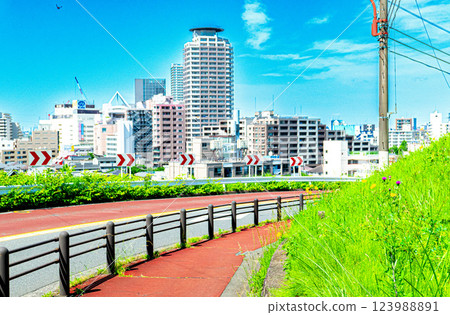 A photo of Seiseki-Sakuragaoka Station, the model location for the anime film, taken from Irohazaka Road and edited to look like an original anime drawing. 123988891