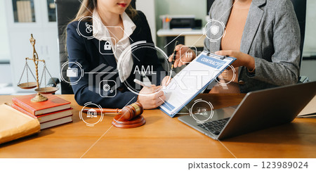 AML Anti Money Laundering Financial Bank Business Concept. judge in a courtroom using laptop and tablet 123989024