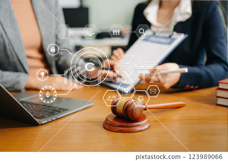 Copyright or patent concept, Business team analyzing data and using smart phone and tablet with virtual screen 123989066