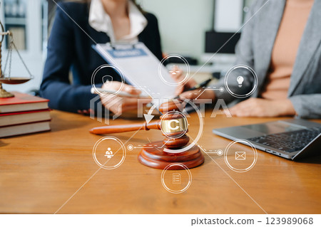 Copyright or patent concept, Business team analyzing data and using smart phone and tablet with virtual screen Copyright or patent concept, Business team analyzing data and using smart phone and tablet with virtual screen 123989068