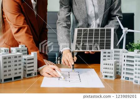 Business team people planning hand using laptop for working technology and business Net zero and carbon neutral 123989201