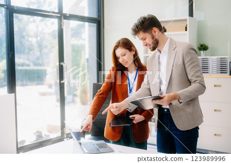 Portrait of success business people working together in modern office. 123989996