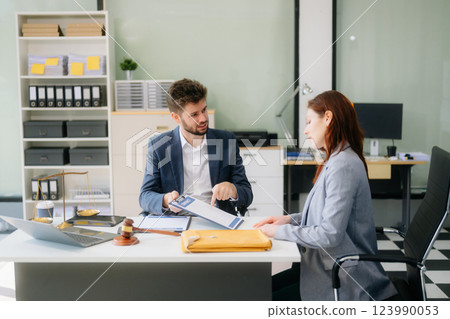 Modern lawyer office a professional discussion, legal documents, and teamwork. Perfect Modern lawyer office a professional discussion, legal documents, and teamwork. Perfect 123990053