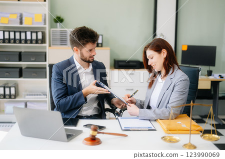 Modern lawyer office a professional discussion, legal documents, and teamwork. Perfect 123990069