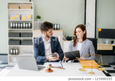 Modern lawyer office a professional discussion, legal documents, and teamwork. Perfect 123990103