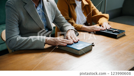 Christians are congregants join hands to pray and seek the blessings Christians are congregants join hands to pray and seek the blessings 123990608