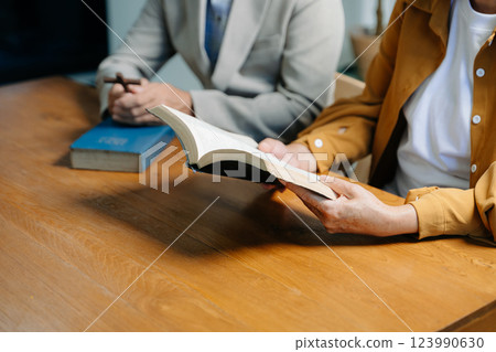 Christians are congregants join hands to pray and seek the blessings Christians are congregants join hands to pray and seek the blessings 123990630