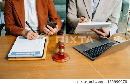 business people and lawyers discussing contract papers sitting at the table. Concepts 123990678