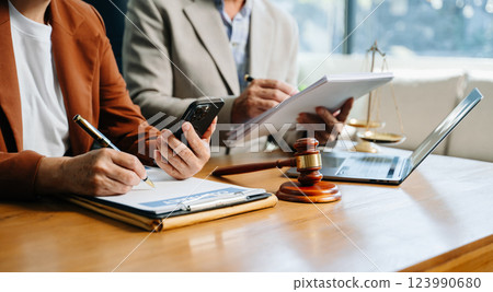 business people and lawyers discussing contract papers sitting at the table. Concepts 123990680
