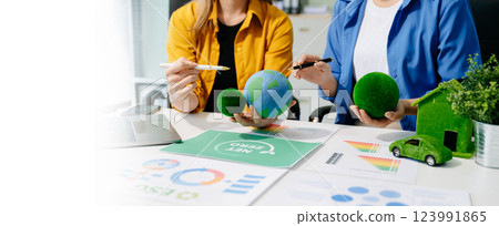 business team people planning and discussing on recycle reduce reuse policy symbol in office meeting room. 123991865