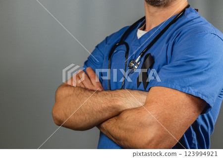 Healthcare professional supports awareness with black ribbon on scrubs Healthcare professional supports awareness with black ribbon on scrubs 123994921