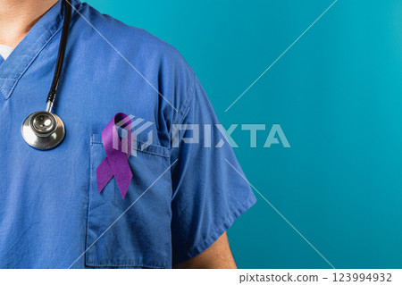 Healthcare worker wearing purple ribbon on scrubs to raise awareness 123994932