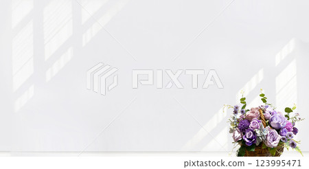 Flower arrangement placed by the window in the living room Flower arrangement placed by the window in the living room 123995471