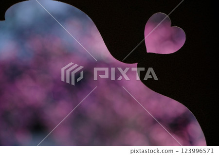 Heart-shaped boar's eye window and pink spring image Heart-shaped boar's eye window and pink spring image 123996571