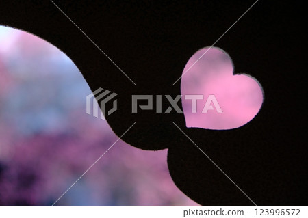 Heart-shaped boar's eye window and pink spring image Heart-shaped boar's eye window and pink spring image 123996572