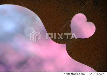 Heart-shaped boar's eye window and pink spring image 123996574