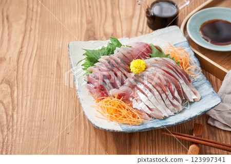 Fresh horse mackerel sashimi served on a plate 123997341