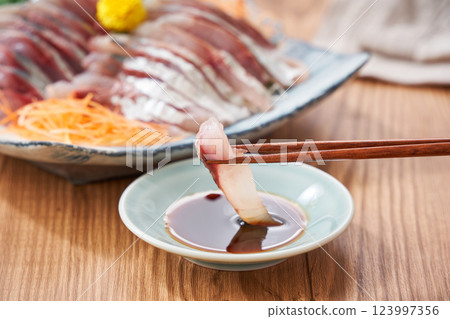 Fresh horse mackerel sashimi served on a plate 123997356