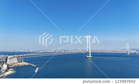 Akashi Kaikyo Bridge with a clear blue sky in the background Akashi Kaikyo Bridge with a clear blue sky in the background 123997692