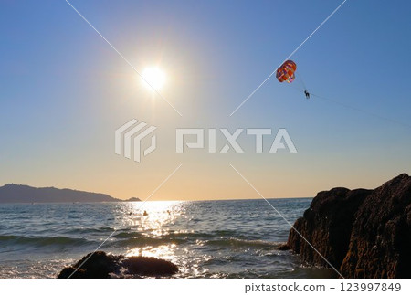 Skydiving, beach vacation on a hot day Skydiving, beach vacation on a hot day 123997849