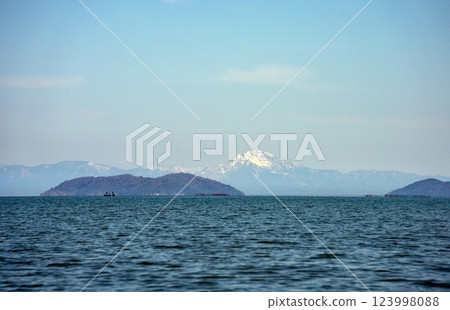 View of the north part of Kohoku through a telephoto lens from the lakeshore in Moriyama City View of the north part of Kohoku through a telephoto lens from the lakeshore in Moriyama City 123998088