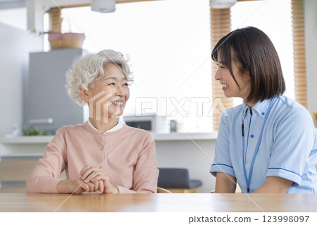 Smiling senior woman and female care staff Smiling senior woman and female care staff 123998097