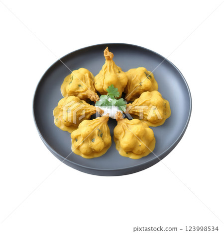 Kadhi Pakora - A traditional dish made with fried gram flour dumplings (pakoras) soaked in a tangy yogurt-based gravy spiced 123998534