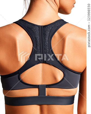 chic charcoal sports bra with a mesh back and adjustable straps. The front features a unique geometric design with contrasting 123998550