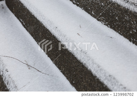 Snow piled stairs 123998702
