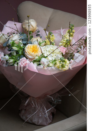 Delicate composition of white and pink roses in a basket Delicate composition of white and pink roses in a basket 123998935