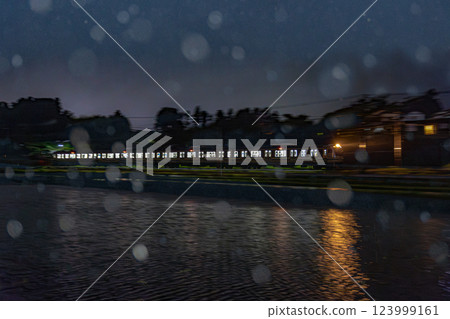 E217 series train running in heavy rain E217 series train running in heavy rain 123999161