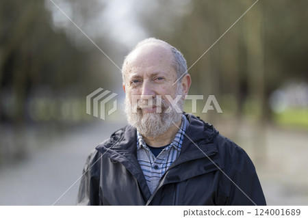Portrait of smiling senior man enjoying retirement in park Portrait of smiling senior man enjoying retirement in park 124001689