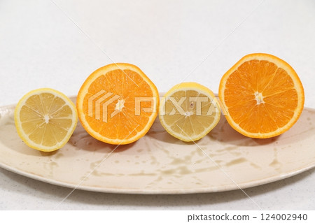 Fresh oranges and lemons Fresh oranges and lemons 124002940