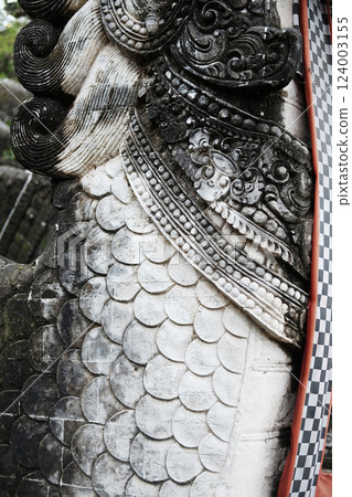Close up detail scales of Ancient lion stucco statue is god and belief in Hindu with religion and culture at the temple in Bali, Indonesia 124003155