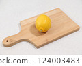 Lemon on a cutting board 124003483