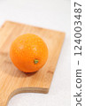 Oranges in a wooden bowl 124003487