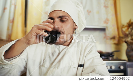 Man Chef Happy Drinking His Homemade Italian Calabrian Red Wine In The Kitchen 124004902