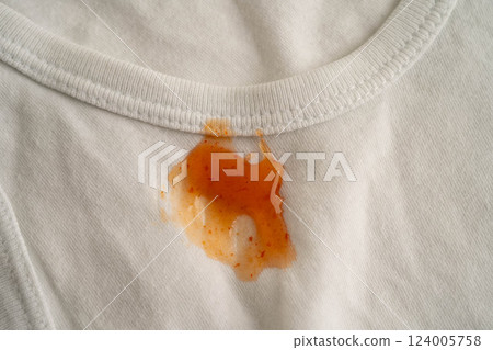 Dirty tomato sauce stain removal or ketchup on cloth accident to wash with washing powder, cleaning housework. 124005758