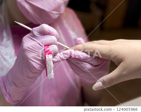 Professional manicure process with nail cleaning brush and protective gloves 124005966