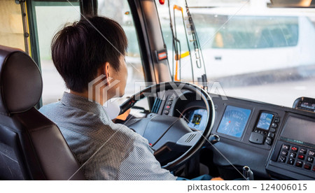 Men driving a left-handed car 124006015