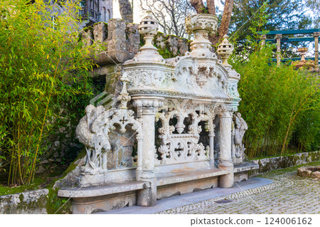Old romantic bench at park of Quinta da Regaleira palace in Sintra, Portugal Old romantic bench at park of Quinta da Regaleira palace in Sintra, Portugal 124006162