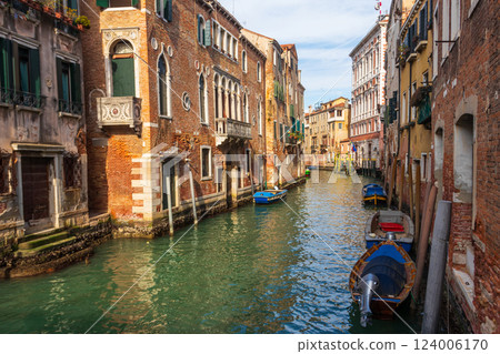Traditional narrow romantic canal with old houses in Venice, Italy 124006170