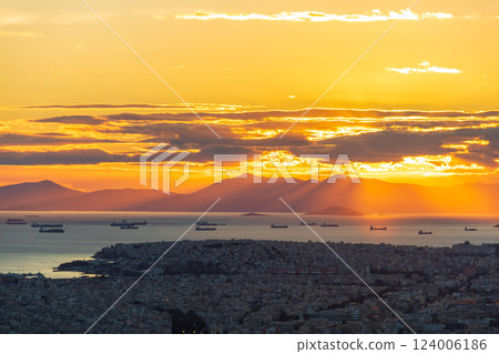 A breathtaking view of the sunset over the city of Athens, Greece from the top of the Lycabettus hill 124006186