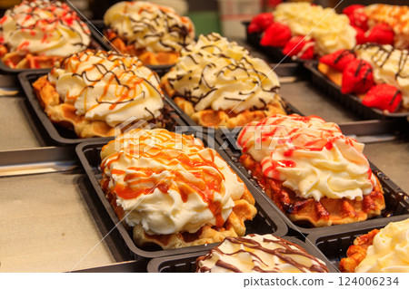 Belgian waffles with colorful sweet toppings and fruits for sale in Brussels, Belgium 124006234