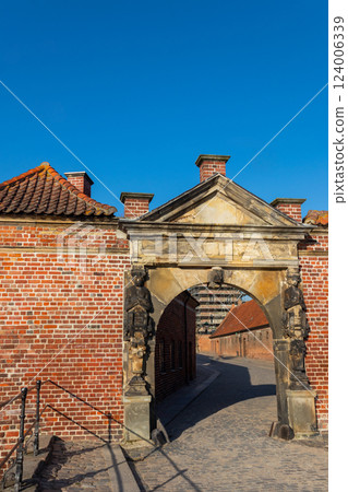 Arched gate to Frederiksborg castle in Hillerod, Denmark 124006339
