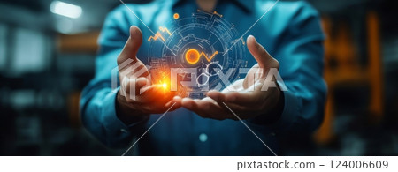 Hands Holding Various Colorful Graphs and Growth Indicators to Represent Analysis and Future Business Trends 124006609